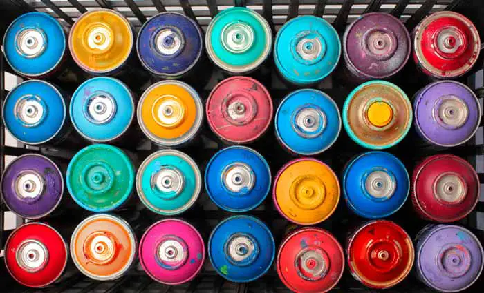 Spray paint cans of many colors