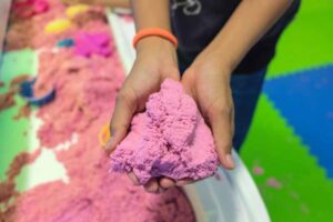 Kinetic sand in hands